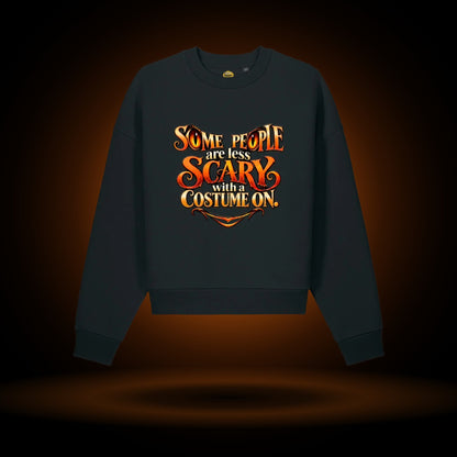 Less Scary in a Costume Halloween sweatshirt, black, with an orange glow